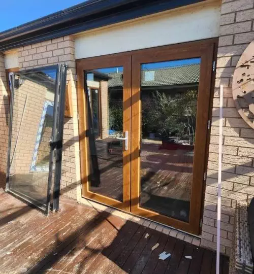 A UPVC French door with a glass window on a deck.